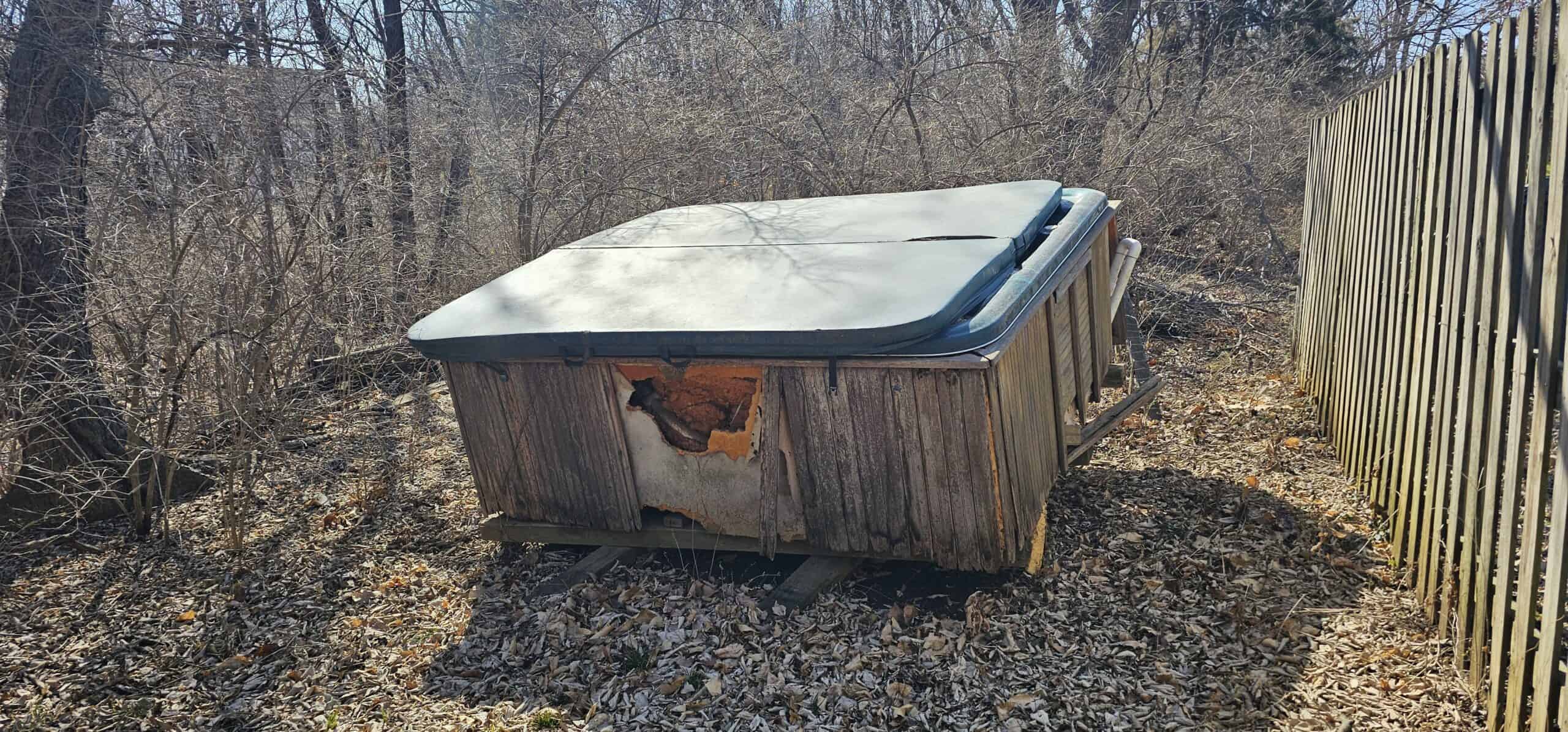 Hot tub removal in Kansas City, MO — A Plus Junk Removal KC team on the job